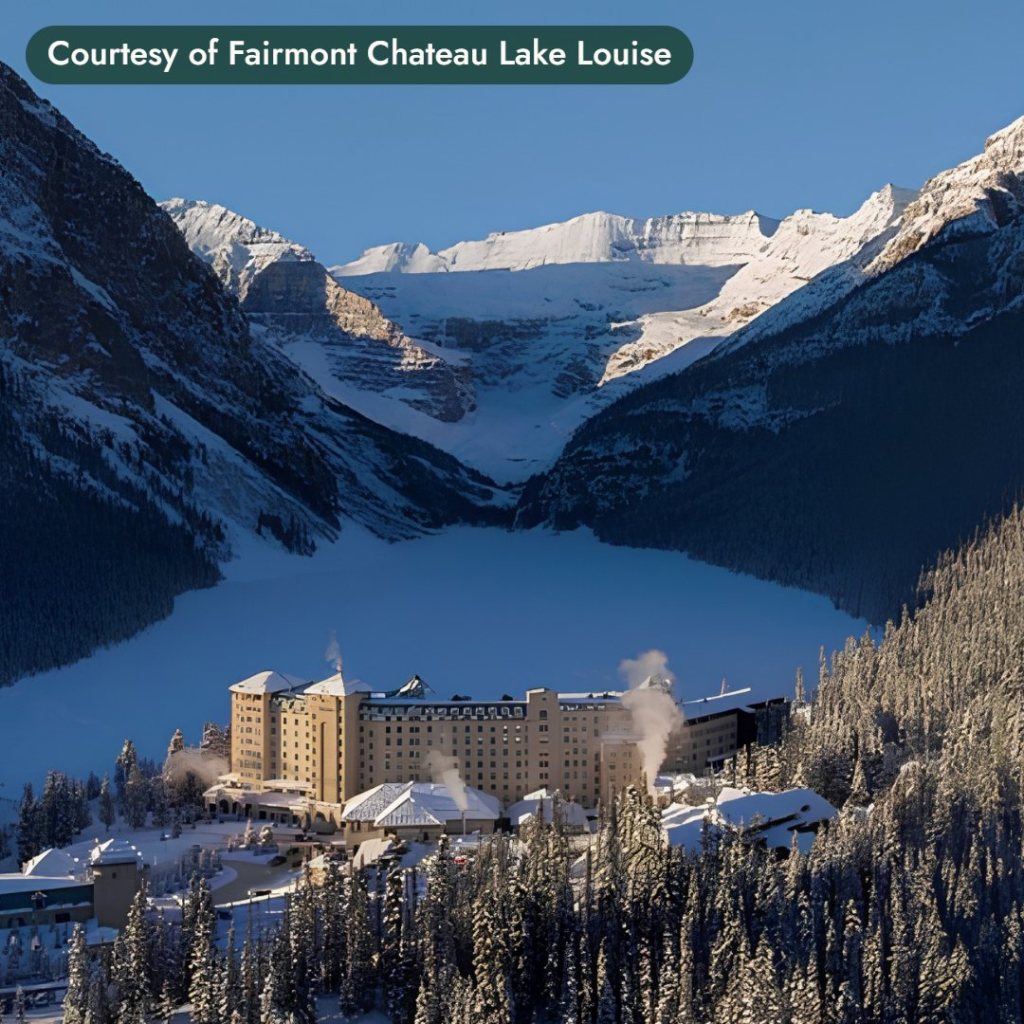 A grand hotel at the edge of a frozen lake below snowy peaks in Banff. Courtesy of Fairmont Chateau Lake Louise.