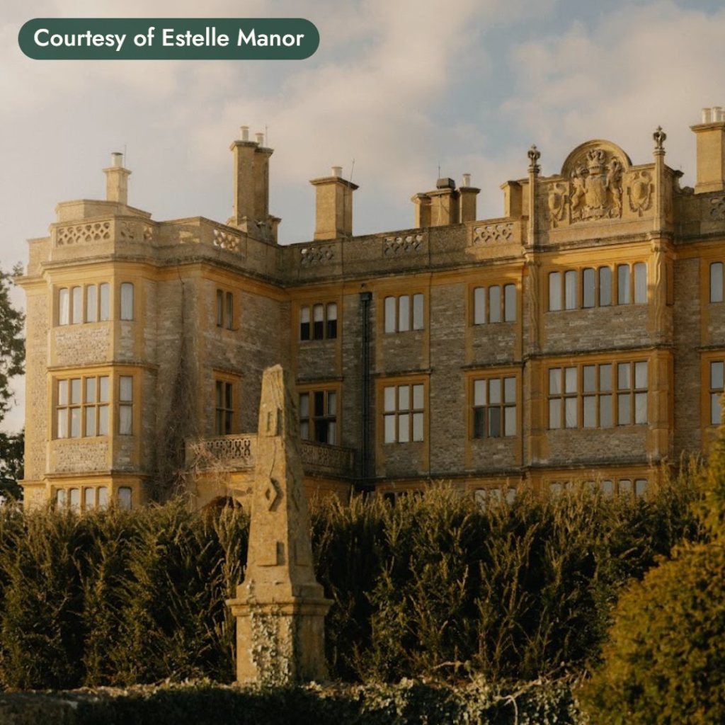 A stone manor house in golden light in the English countryside. Courtesy of Estelle Manor.