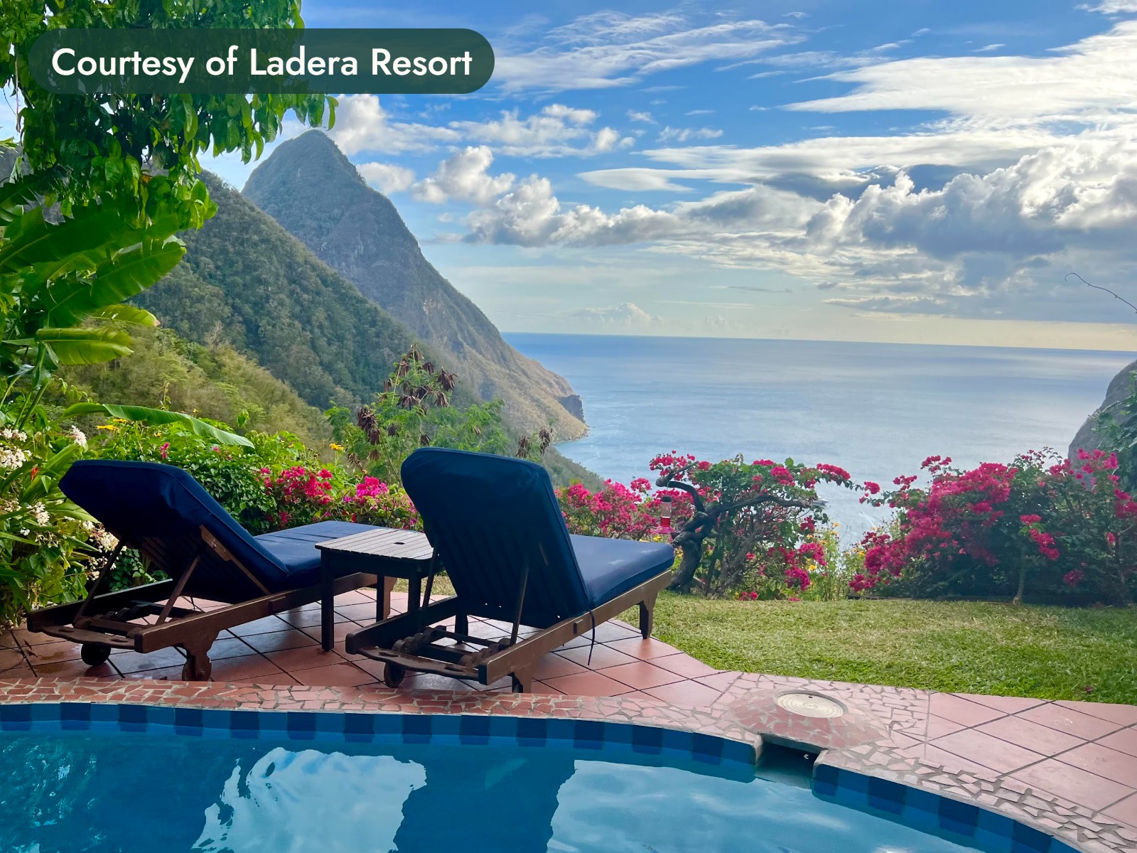 Two blue loungers beside a plunge pool, with one of the Pitons and the sea beyond in St. Lucia. Courtesy of Ladera Resort.