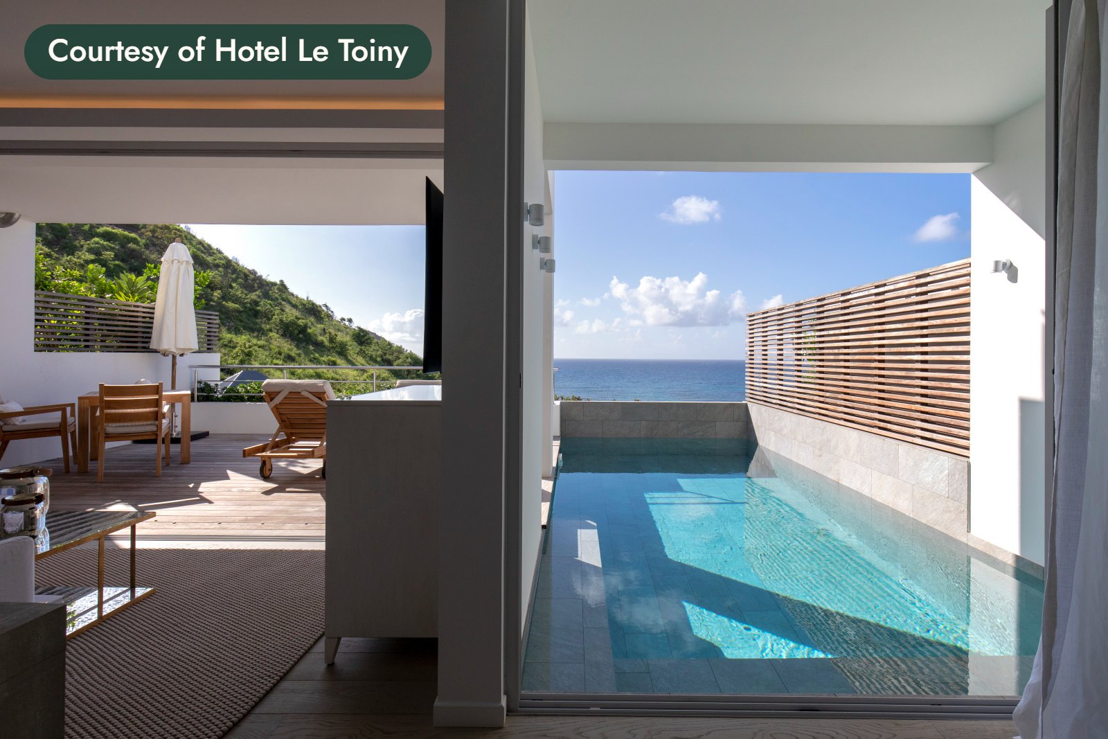 A plunge pool on a suite terrace beside a living room, with green hills and the sea beyond. Courtesy of Hotel Le Toiny.