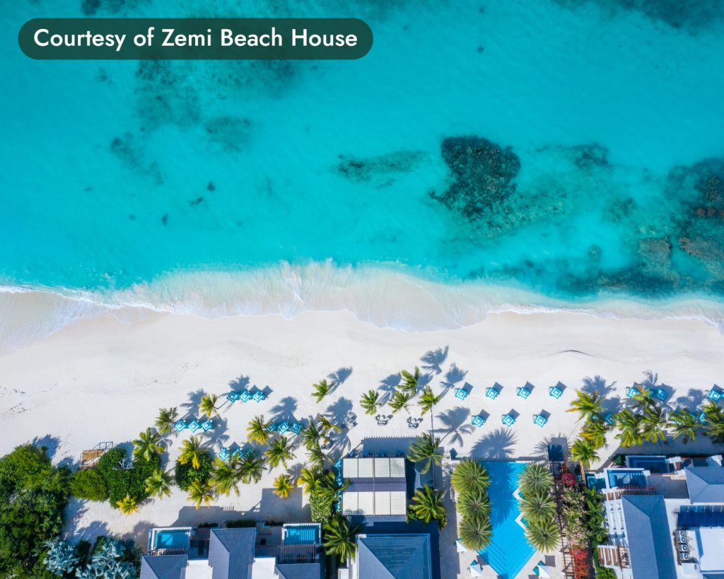 Beach resort beside turquoise water, seen from above. Courtesy of Zemi Beach House.
